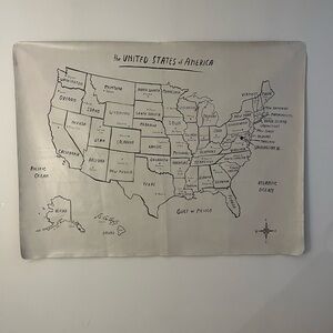 Gray Tapestry Wall Decor featuring a minimalist map of the United States